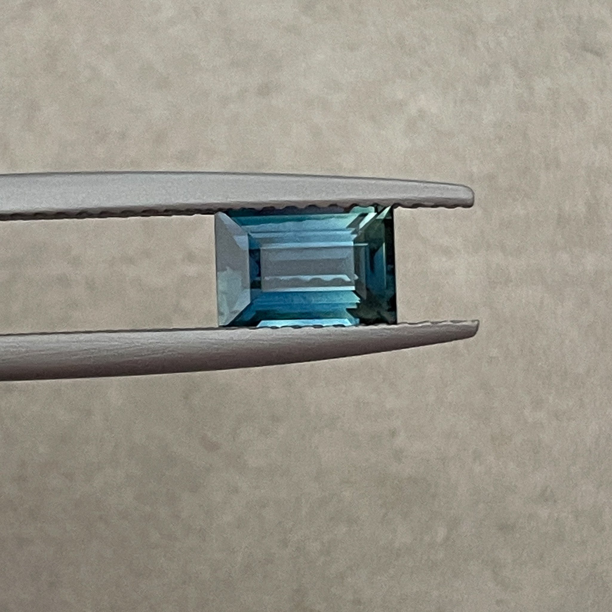 Natural teal blue sapphire 1.15 Ct loose baguette cut gemstone from NASHGEMS, perfect for engagement rings or custom jewelry.