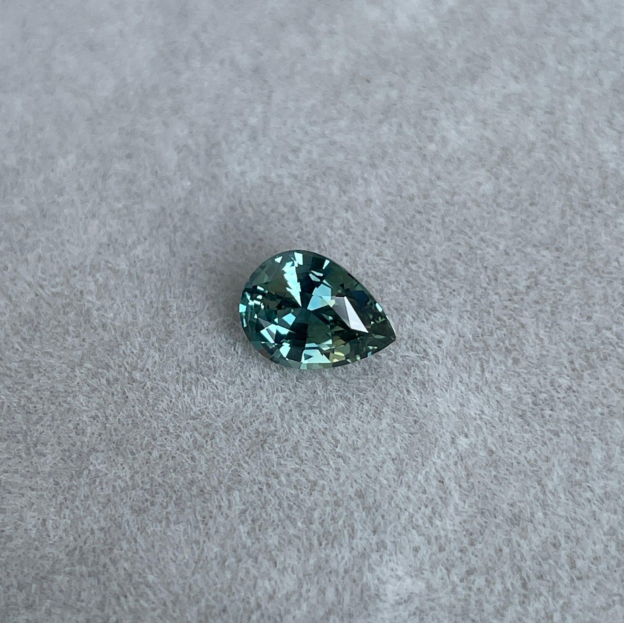 teal blue green parti sapphire pear drop cut gem 